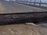 Атыраудағы Қызылқоға ауданында көпірді тасқын су шайып кетті